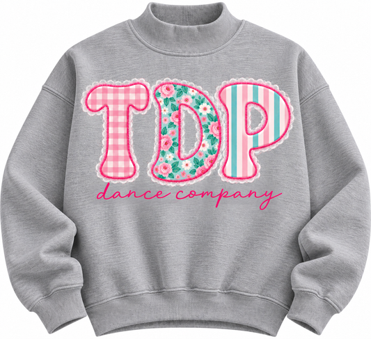 Heather gray TDP Floral Patchwork Mock Neck with gingham, floral and striped lettering